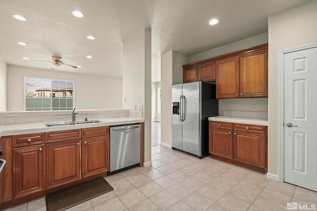 1853 Resistol Dr, Reno, NV 89521 - kitchen featuring appliances with stainless steel finishes, a sink, brown cabinets, ceiling fan, and recessed lighting