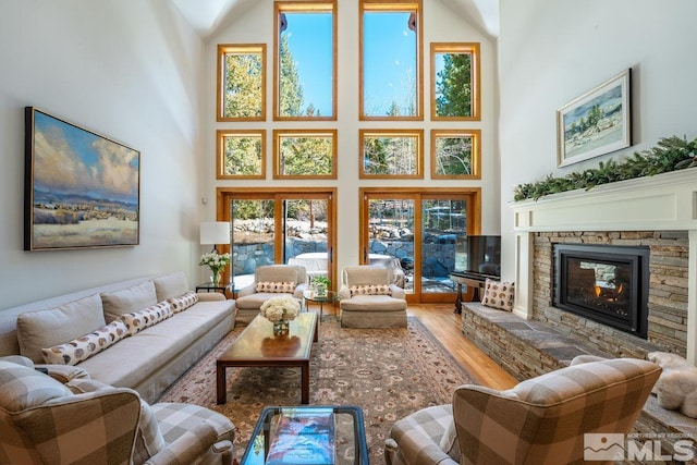 2147 The Back Rd, Glenbrook, NV 89413 - living room featuring a towering ceiling, wood finished floors, and a fireplace