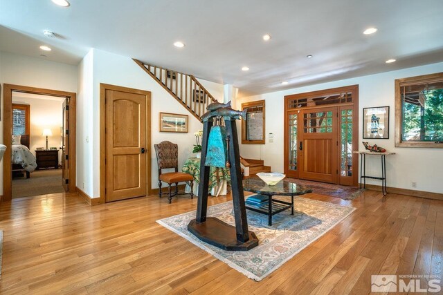 2147 The Back Rd, Glenbrook, NV 89413 - entrance foyer with light wood-type flooring, baseboards, recessed lighting, and stairs