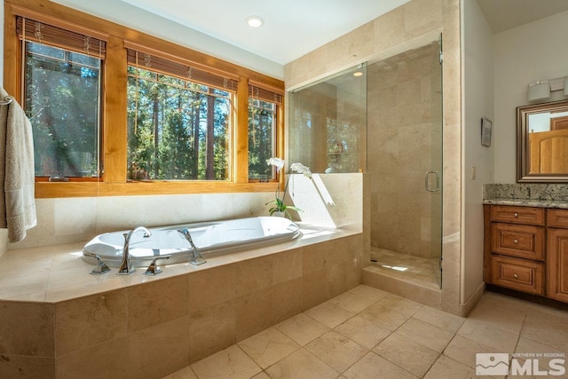 2147 The Back Rd, Glenbrook, NV 89413 - bathroom with a bath, a shower stall, vanity, and tile patterned flooring