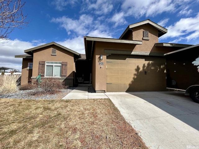 3243 Hackamore Way, Winnemucca, NV 89445 - view of front of property with stucco siding, driveway, and an attached garage