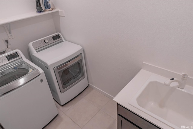 7216 Mustengo Dr, Reno, NV 89506 - washroom with washer and dryer and light tile patterned flooring