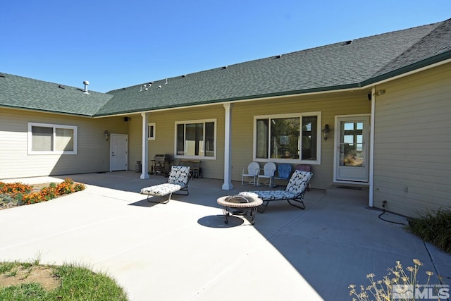 45 Lower Colony Rd, Wellington, NV 89444 - back of house with a fire pit, a patio area, and roof with shingles
