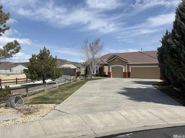10316 Sterling View Ct, Reno, NV 89521 - ranch-style home featuring a garage, concrete driveway, and stucco siding