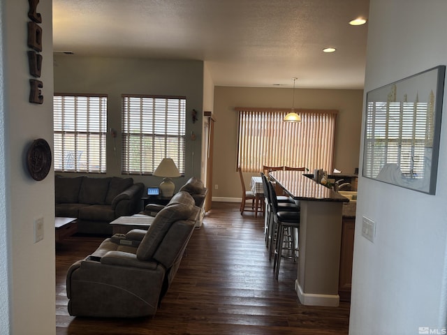 10316 Sterling View Ct, Reno, NV 89521 - living area with dark wood finished floors, recessed lighting, and baseboards