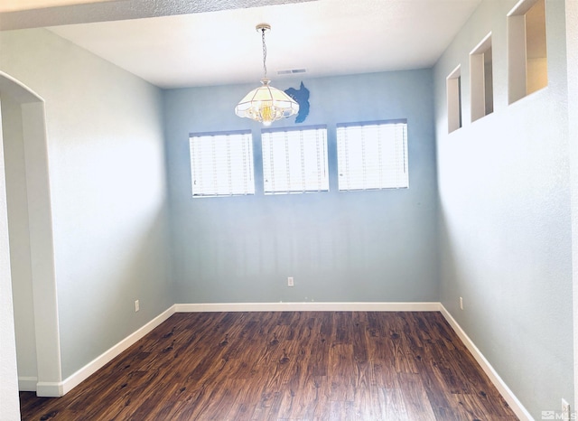 10316 Sterling View Ct, Reno, NV 89521 - empty room with a chandelier, dark wood-type flooring, and baseboards