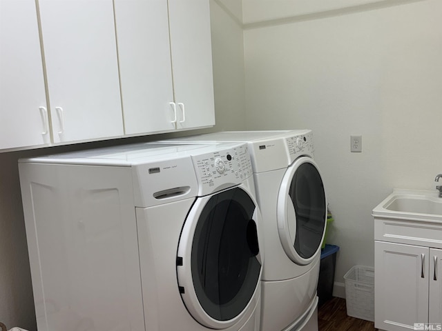 10316 Sterling View Ct, Reno, NV 89521 - washroom featuring cabinet space, washer and clothes dryer, and dark wood-style floors