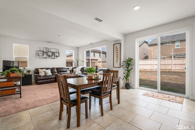 9726 Pachuca Dr, Reno, NV 89521 - dining room featuring healthy amount of natural light, light carpet, light tile patterned floors, and recessed lighting