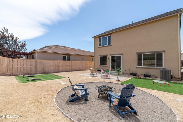 9726 Pachuca Dr, Reno, NV 89521 - rear view of property featuring a fire pit, a patio, and stucco siding