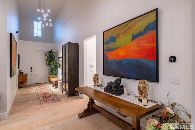 720 Marewood Trl, Reno, NV 89511 - foyer with a towering ceiling, light wood-style floors, and baseboards