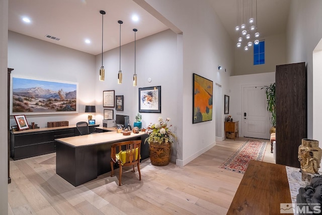 720 Marewood Trl, Reno, NV 89511 - office space featuring a high ceiling, baseboards, and light wood-style floors