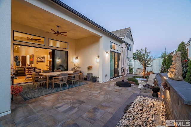 720 Marewood Trl, Reno, NV 89511 - view of patio featuring a ceiling fan, outdoor dining area, and fence