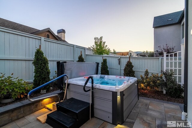 720 Marewood Trl, Reno, NV 89511 - view of patio / terrace with a hot tub and a fenced backyard