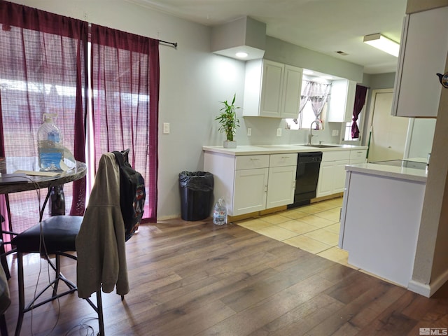 1391 Langley Dr, Gardnerville, NV 89460 - kitchen featuring a sink, dishwasher, light wood-style floors, white cabinets, and light countertops