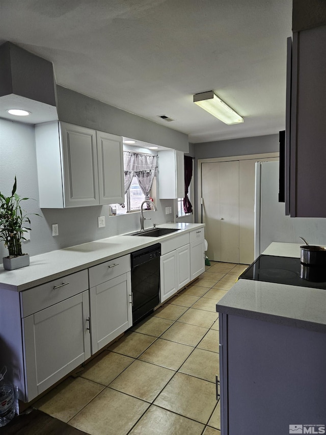 1391 Langley Dr, Gardnerville, NV 89460 - kitchen featuring dishwasher, a sink, white cabinetry, light tile patterned flooring, and light countertops