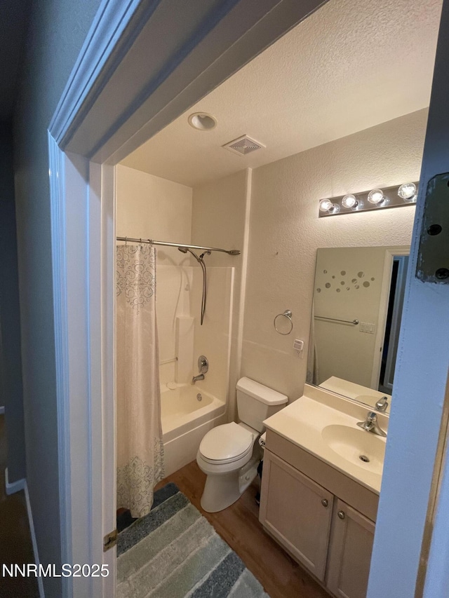 158 Desert Springs Ln, Fernley, NV 89408 - full bath featuring vanity, a textured wall, toilet, wood finished floors, and a textured ceiling