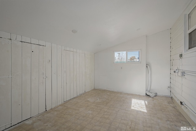 939 Bates Ave, Reno, NV 89502 - unfurnished room with lofted ceiling and tile patterned floors