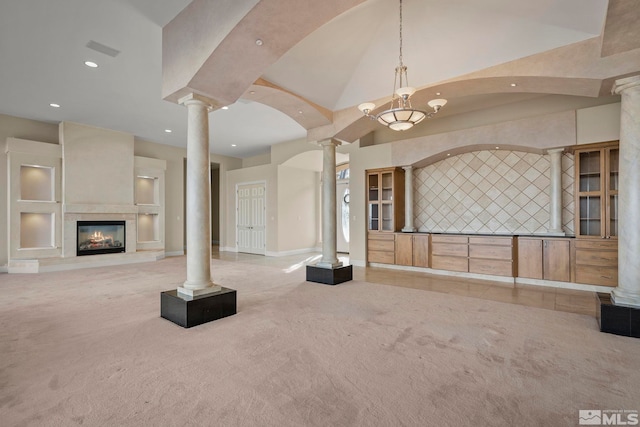 1150 Eagle Vista Ct, Reno, NV 89511 - unfurnished living room featuring decorative columns, carpet flooring, recessed lighting, a glass covered fireplace, and baseboards
