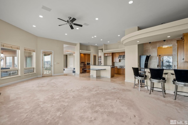 1150 Eagle Vista Ct, Reno, NV 89511 - living area featuring recessed lighting, light carpet, a ceiling fan, and baseboards