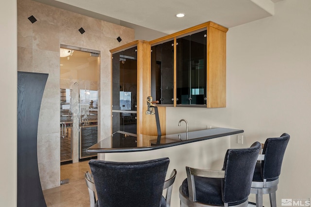 1150 Eagle Vista Ct, Reno, NV 89511 - bar area with light tile patterned floors and recessed lighting