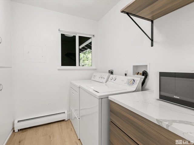 421 Edgewood Dr, Stateline, NV 89449 - laundry area with a baseboard radiator, light wood-style flooring, and separate washer and dryer