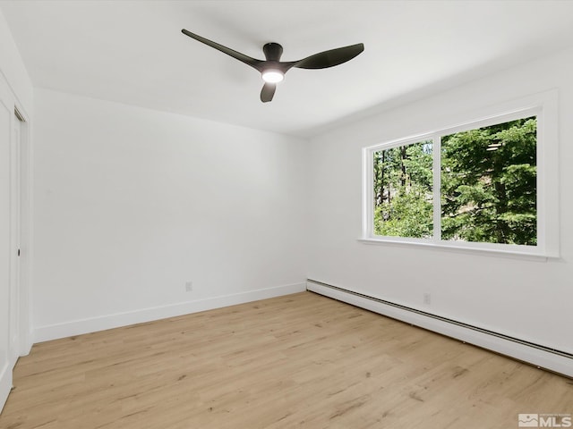 421 Edgewood Dr, Stateline, NV 89449 - unfurnished room featuring baseboard heating, light wood-style floors, a ceiling fan, and baseboards