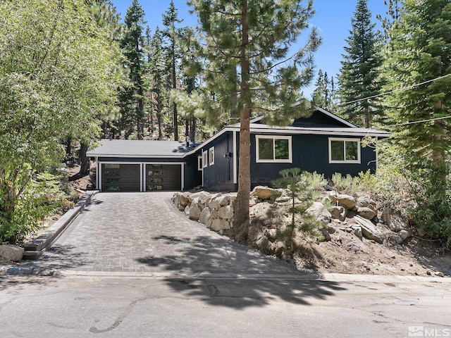 421 Edgewood Dr, Stateline, NV 89449 - view of front of home with a garage and decorative driveway