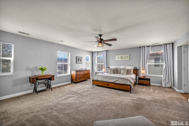 485 Sondrio Ct, Reno, NV 89521 - bedroom with carpet flooring, a textured ceiling, baseboards, and ceiling fan