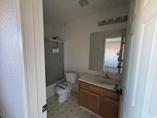 6515 Galice Ct, Sun Valley, NV 89433 - full bath with tile patterned floors, toilet, vanity, and bath / shower combo with glass door