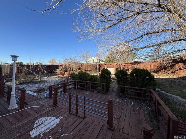 6515 Galice Ct, Sun Valley, NV 89433 - wooden terrace with a fenced backyard