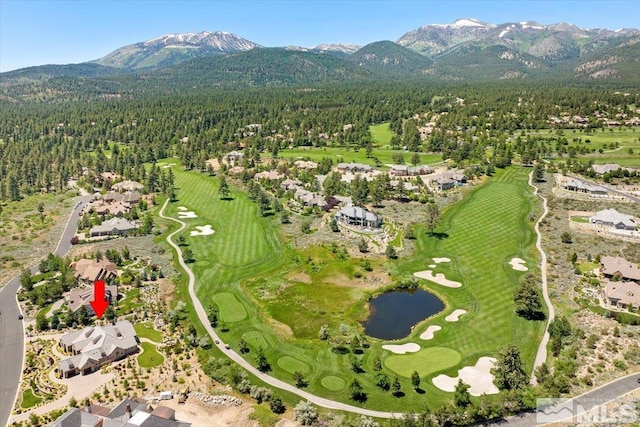 6645 De Chardin Ln, Reno, NV 89511 - aerial view of property's location with a forest, a golf course, a water and mountain view, and nearby suburban area