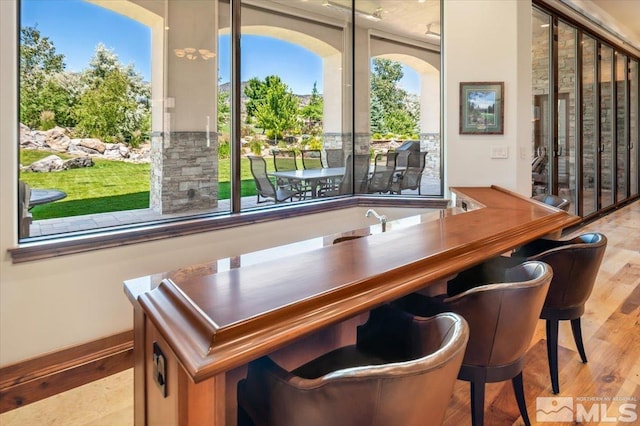 6645 De Chardin Ln, Reno, NV 89511 - bar area with wood finished floors and healthy amount of natural light