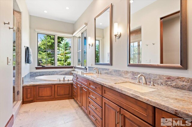 6645 De Chardin Ln, Reno, NV 89511 - full bath featuring a garden tub, double vanity, and recessed lighting
