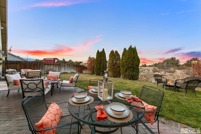 patio terrace at dusk with an outdoor hangout area