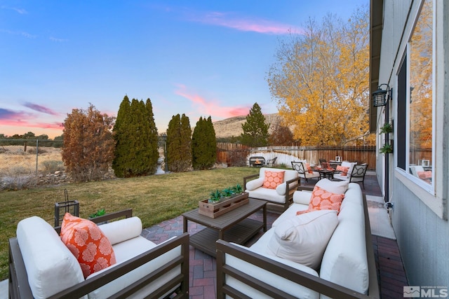 patio terrace at dusk with an outdoor living space