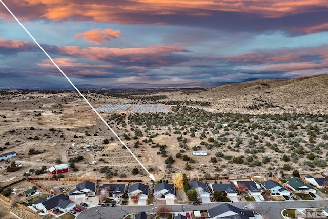 aerial view at dusk of view of desert and a mountain view