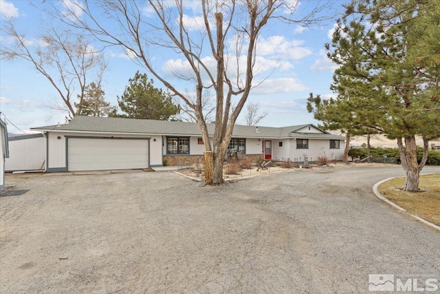 8700 Little Creek Rd, Reno, NV 89508 - single story home featuring dirt driveway and a garage