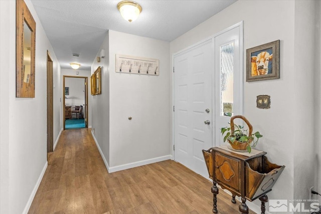 8700 Little Creek Rd, Reno, NV 89508 - foyer entrance featuring light wood-style flooring and baseboards