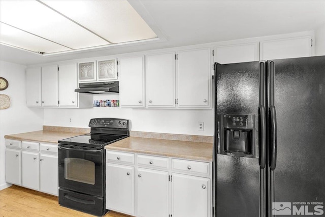 8700 Little Creek Rd, Reno, NV 89508 - kitchen with black appliances, under cabinet range hood, light countertops, and white cabinetry