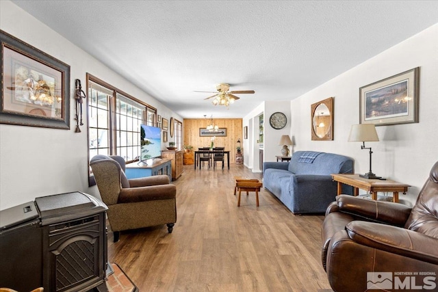 8700 Little Creek Rd, Reno, NV 89508 - living area featuring light wood-style floors, ceiling fan, and a textured ceiling