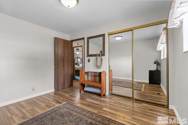 8700 Little Creek Rd, Reno, NV 89508 - bedroom with wood finished floors, a closet, and baseboards