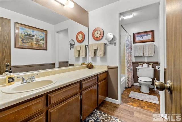 8700 Little Creek Rd, Reno, NV 89508 - full bath with toilet, wainscoting, vanity, and shower / bathtub combination with curtain