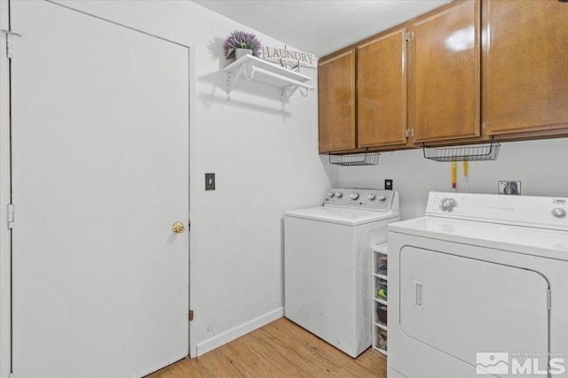 8700 Little Creek Rd, Reno, NV 89508 - clothes washing area featuring cabinet space, separate washer and dryer, and light wood finished floors