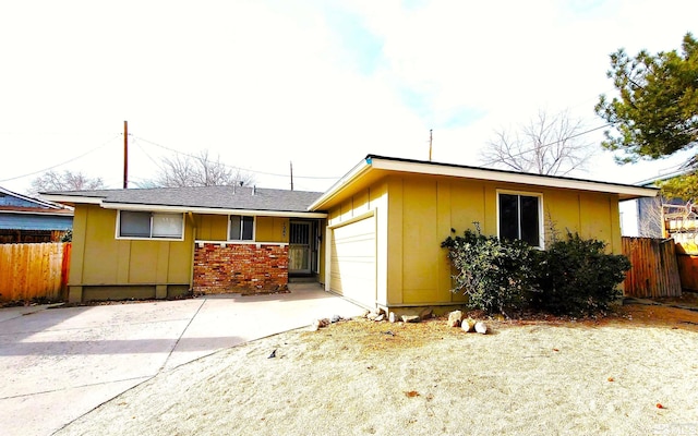 1285 Rayburn Dr, Reno, NV 89503 - ranch-style house featuring fence, an attached garage, and driveway