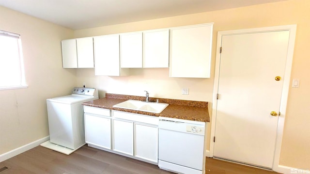 1285 Rayburn Dr, Reno, NV 89503 - clothes washing area featuring washer / clothes dryer, light wood-style flooring, and baseboards