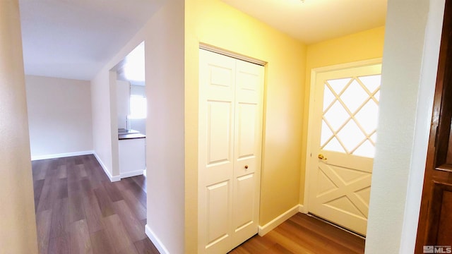 1285 Rayburn Dr, Reno, NV 89503 - hall with dark wood-style flooring, healthy amount of natural light, and baseboards