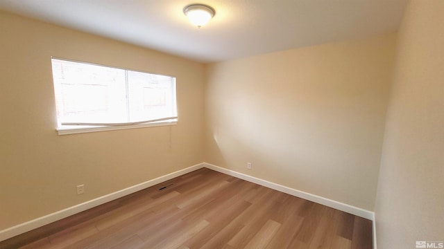 1285 Rayburn Dr, Reno, NV 89503 - empty room featuring wood finished floors and baseboards