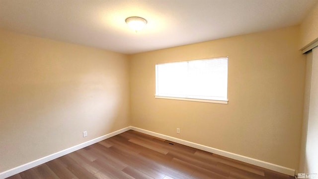 1285 Rayburn Dr, Reno, NV 89503 - unfurnished room with dark wood-style floors and baseboards