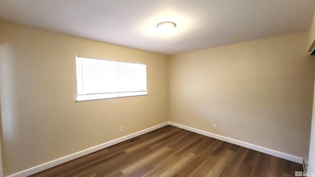 1285 Rayburn Dr, Reno, NV 89503 - unfurnished room featuring dark wood-style flooring and baseboards