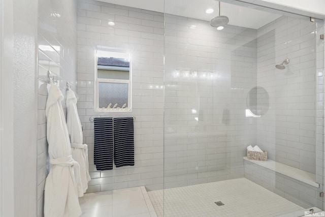 full bathroom featuring tiled shower